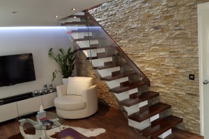 Wooden stairs with glass balustrade